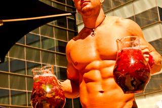West Hollywood makes a splash in Las Vegas as The Abbey Beach debuts at Vdara Hotel and Spa.  Jeffrey Art, one of the handsome Abbey Boys, serves pitchers of cocktails poolside at Vdara's Abbey Beach on Sunday, August 29.  Vdaras chic Pool & Lounge is decked out with The Abbeys colorful flags and beach balls, while its 19 fully appointed cabanas are serviced by the handsome Abbey Boys.  Widely known as one of the most popular West Hollywood hot spots, The Abbey Food & Bar has partnered with Las Vegas party planner Eduardo Cordova and Vdara Hotel & Spa to host The Abbey Beach.  The Abbey Beach at Vdara Pool & Lounge occurs every Sunday now through September 26, noon  6 p.m offering a taste of The Abbeys signature LGBT party in the heart of CityCenter.